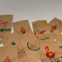 Completed lunch bags decorated by CECI faculty and staff members pile #7